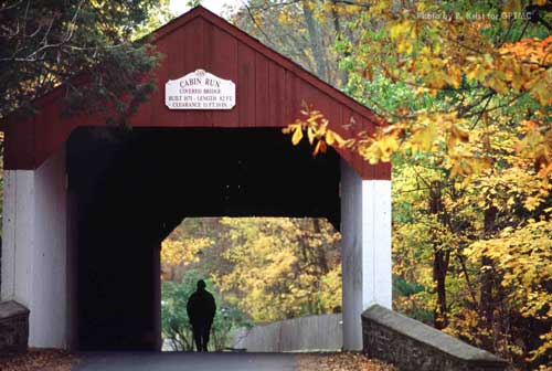 Located in Plumstead Township, Bucks County, this covered bridge, built in 1871, crosses the Cabin Run Creek. Of the 36 covered bridges originally built in Bucks County, only 11 remain.
